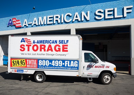 Moving truck parked in front of storage facility