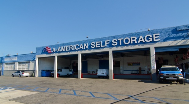 Covered parking lot with cars and large vehicles