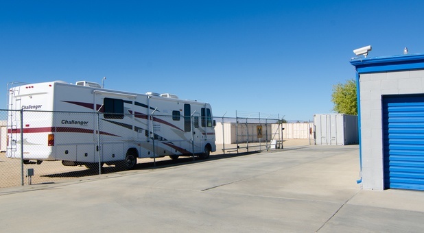 RV parked in fenced lot