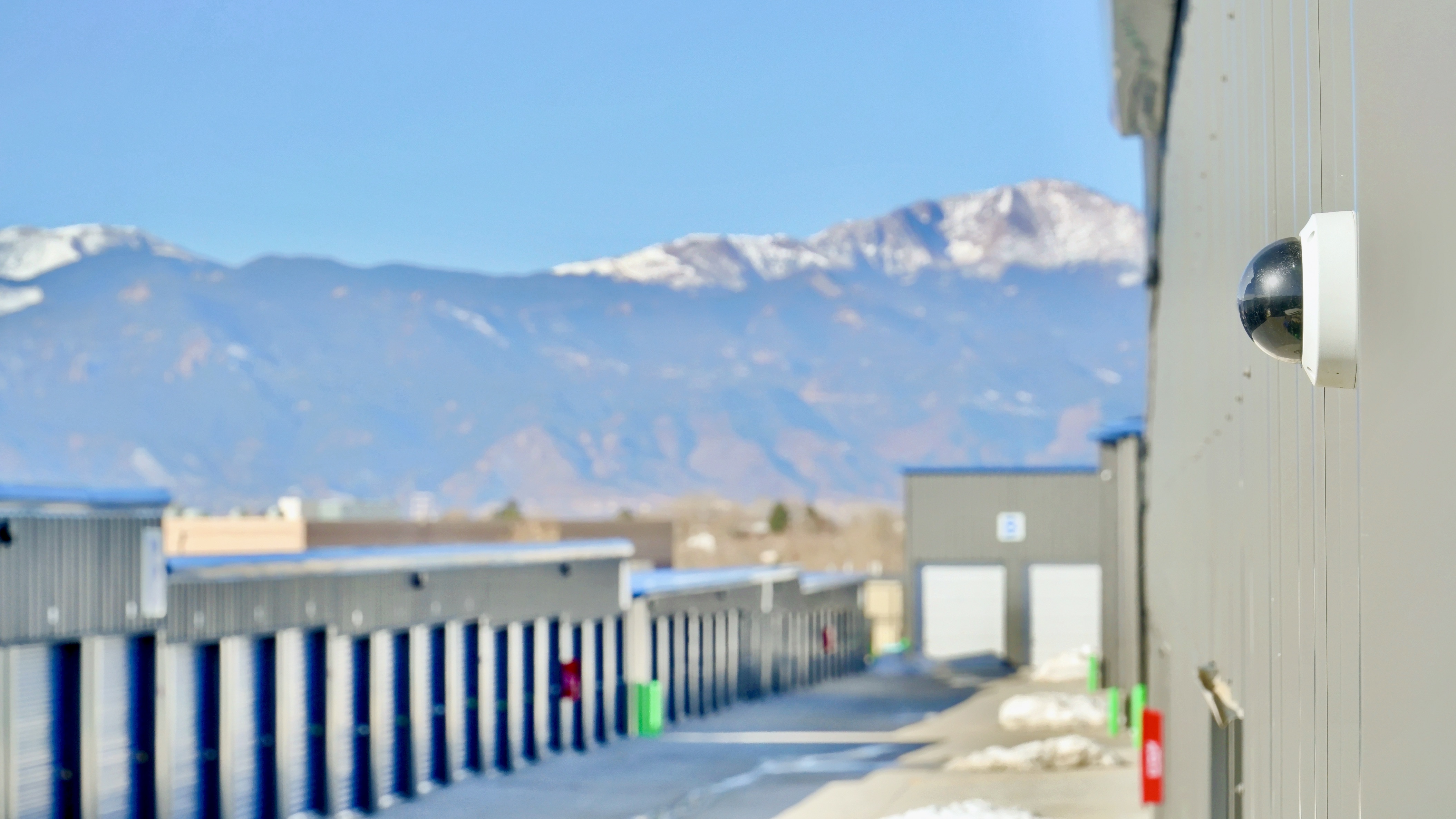 security camera mounted on building overlooking the storage facility