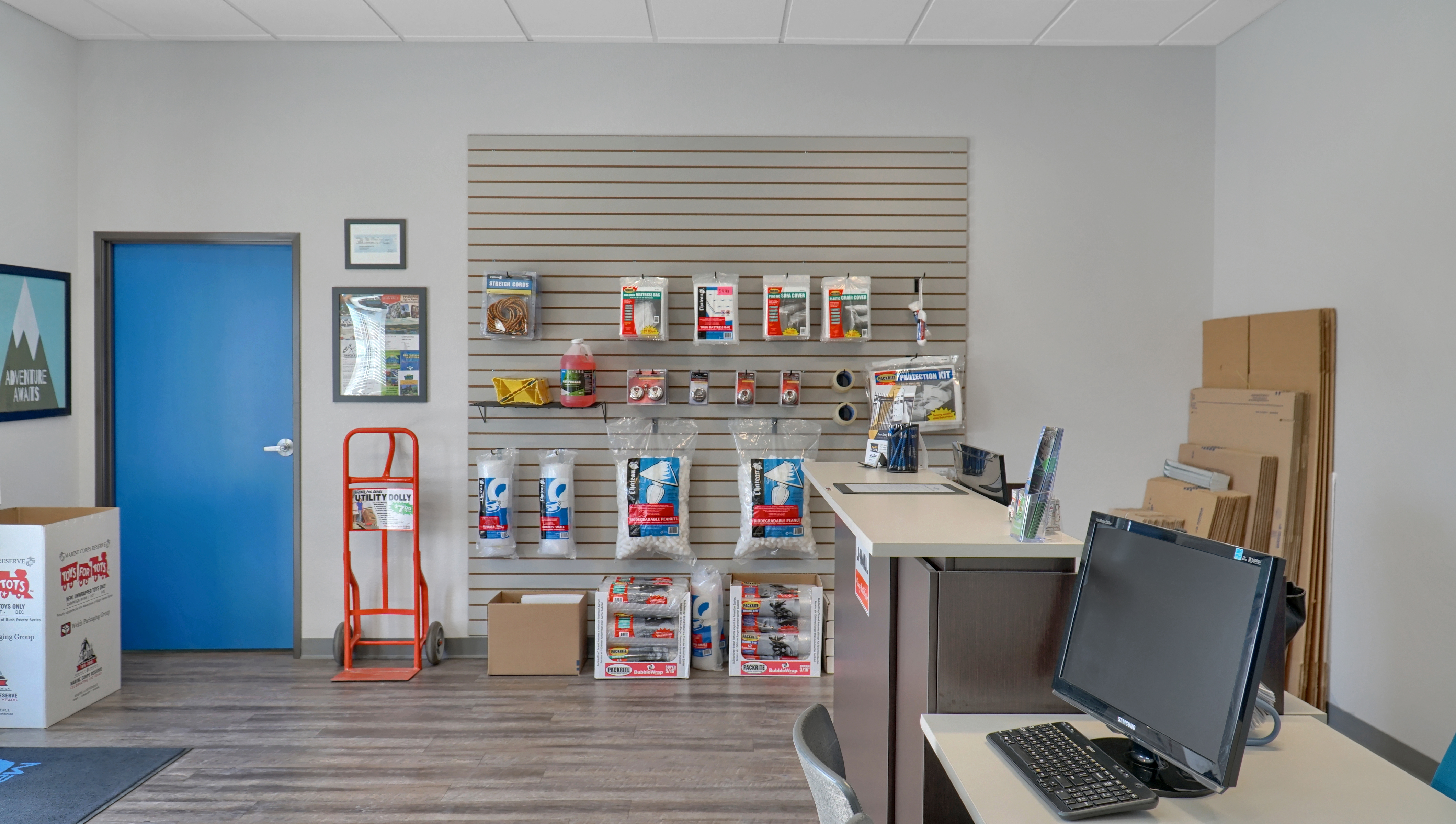 boxes, tape and other packing supplies displayed for purchase in leasing office