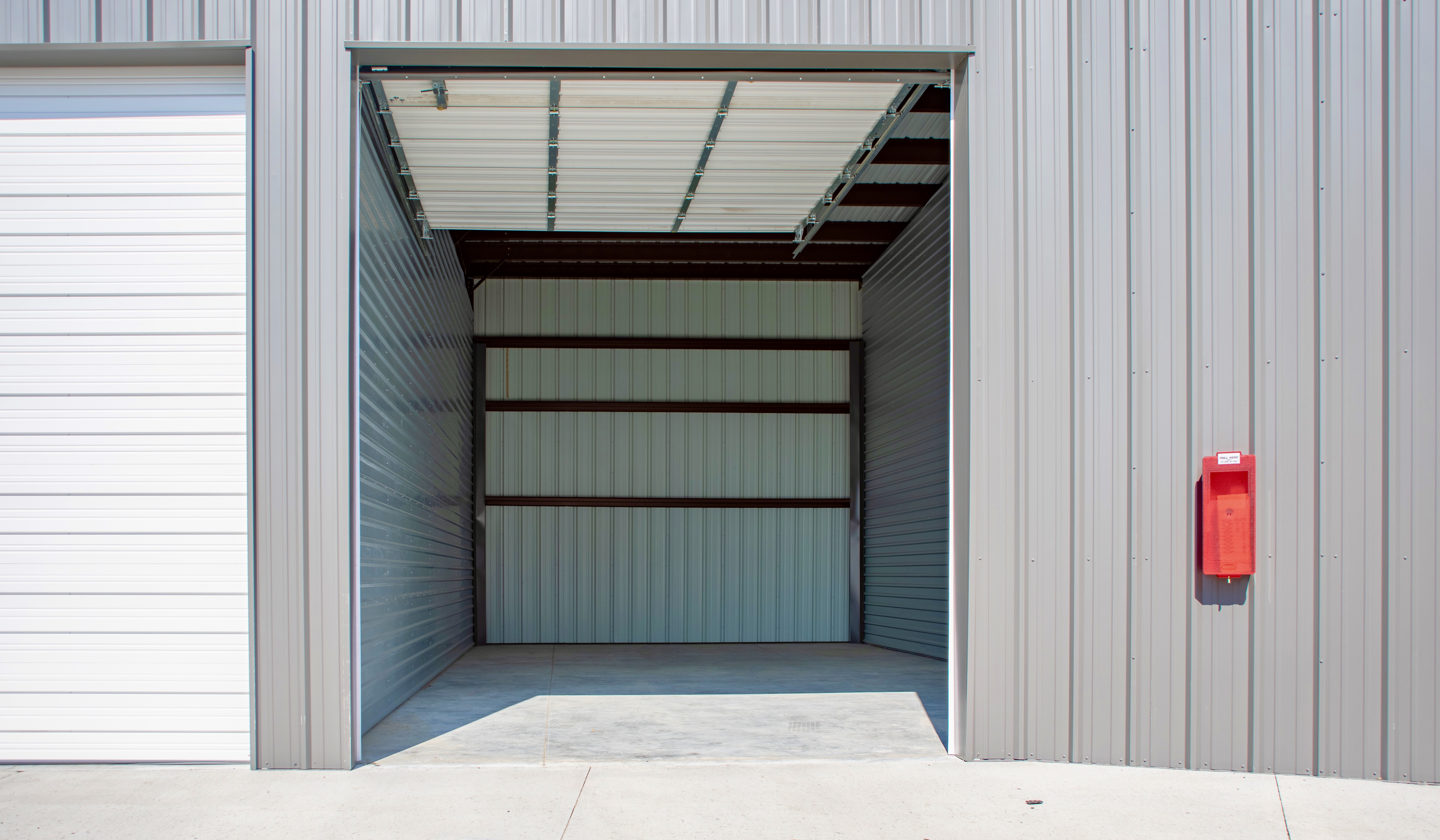 open empty storage unit showing space inside for vehicle