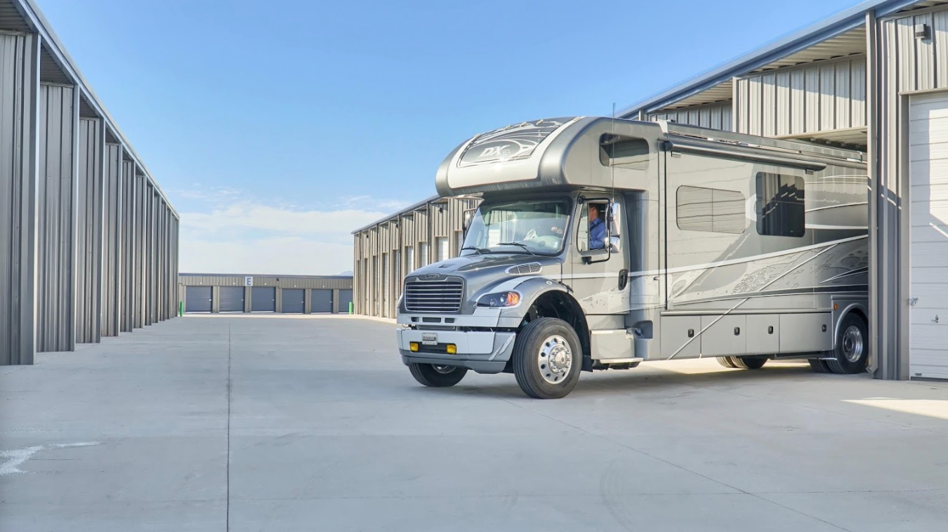 RV backing into a fully enclosed storage unit at Maximum Storage RV and Self Storage
