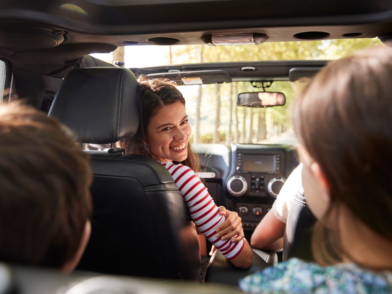 family-driving-together