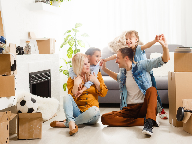 family-sitting-cardboard-boxes