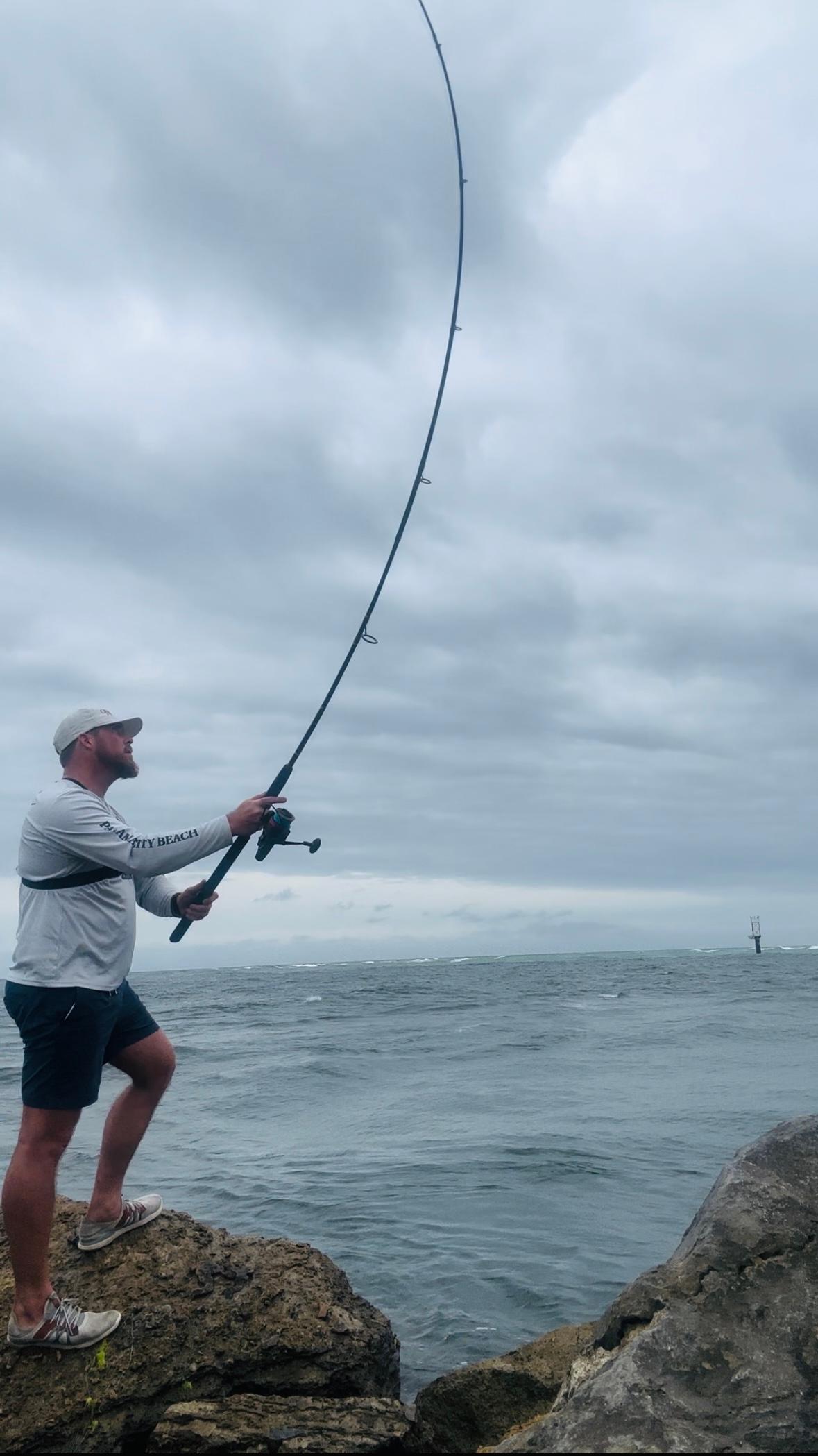 Man Fishing On The Cliffs in Santa Rosa Beach, FL
