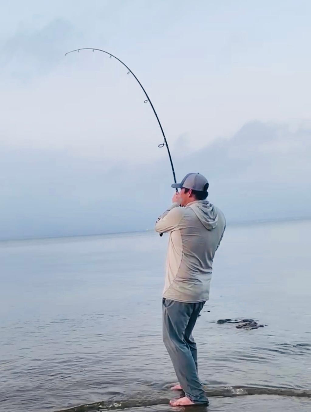 Man Surf Fishing in Santa Rosa Beach, FL