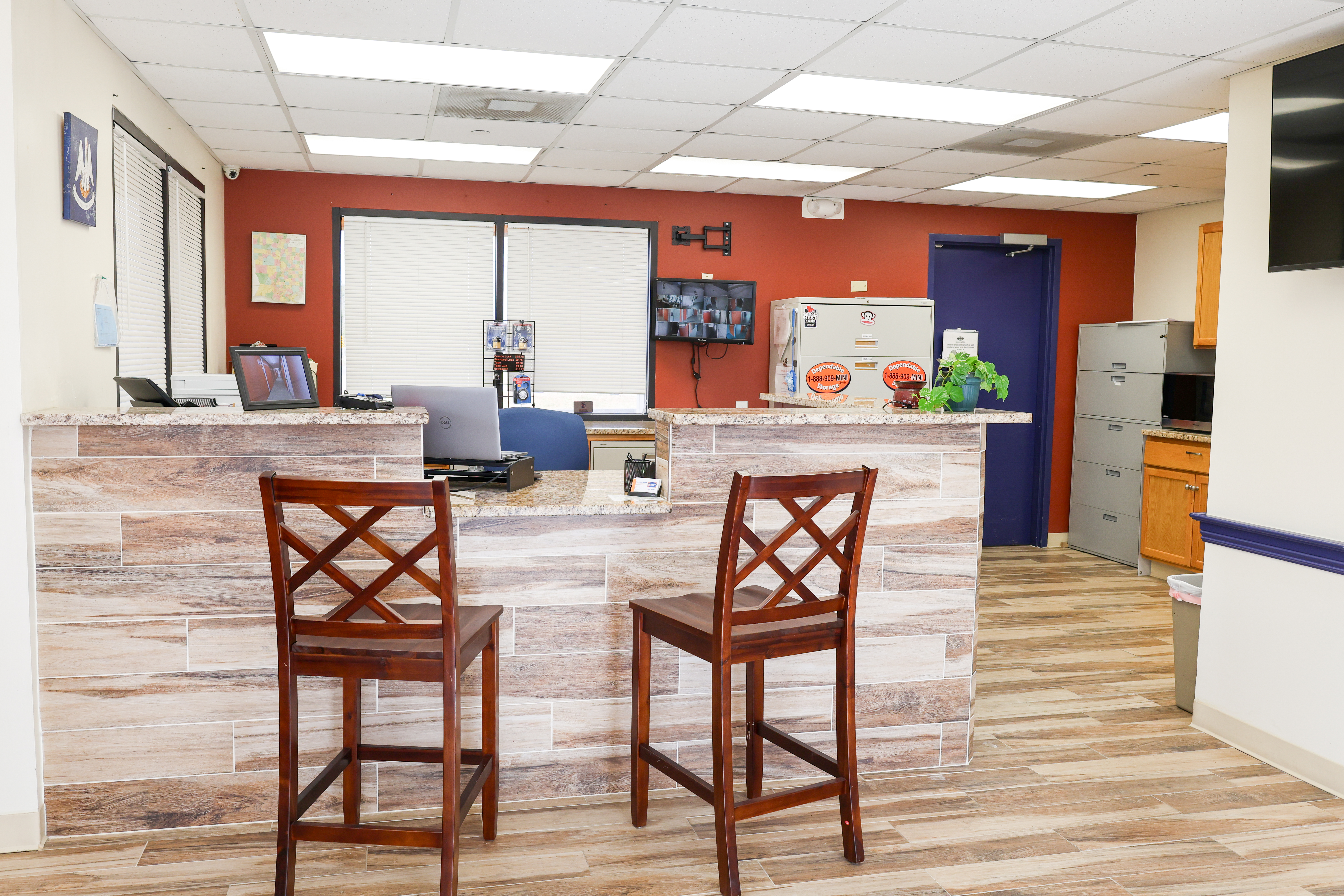 Dependable Storage office interior with customer service desk and modern lobby area