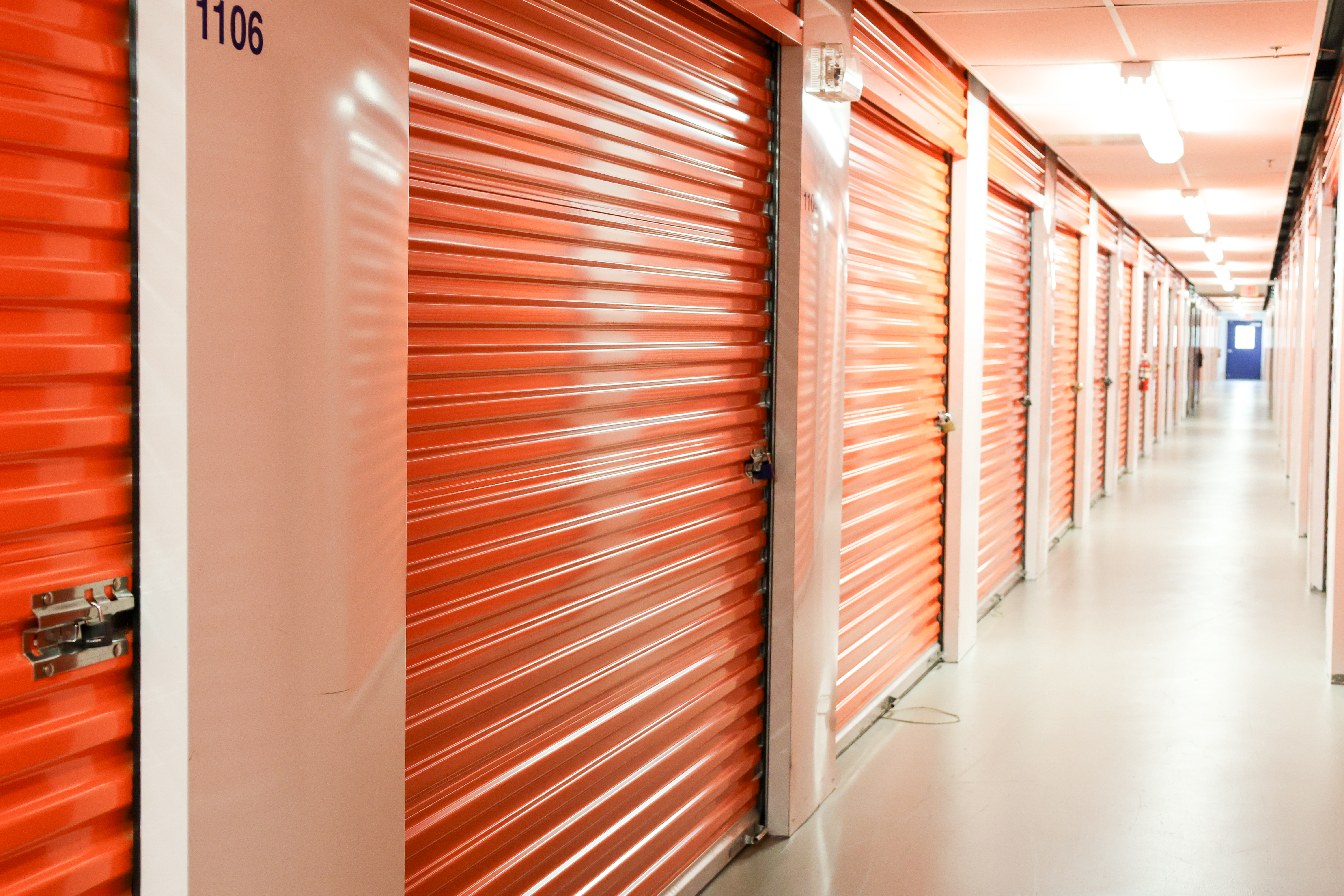Interior hallway of Dependable Storage featuring clean climate-controlled storage units with roll-up doors