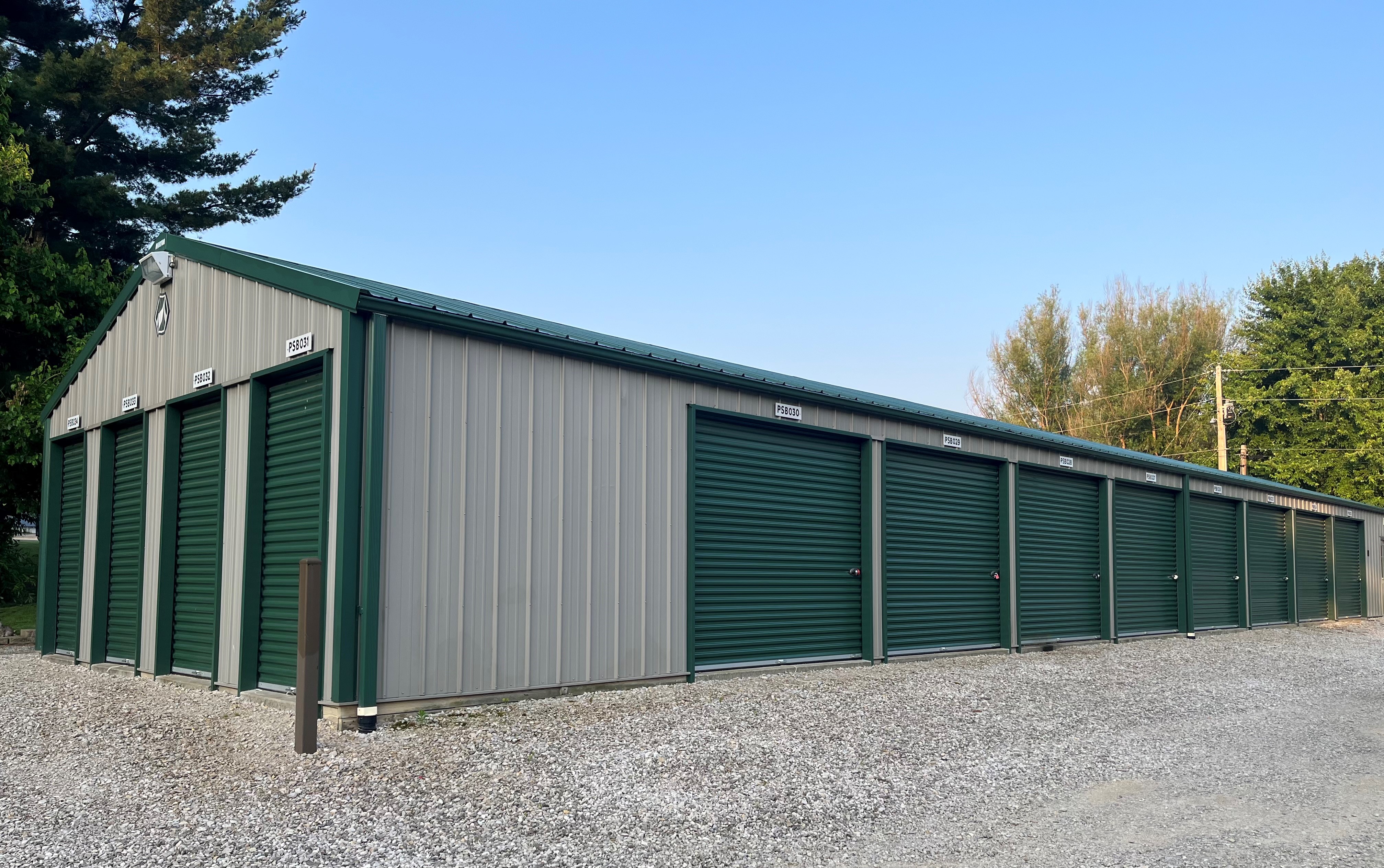 Birdseye facility with convenient drive-up storage, green doors, offering 24/7 access and easy online bill payment.