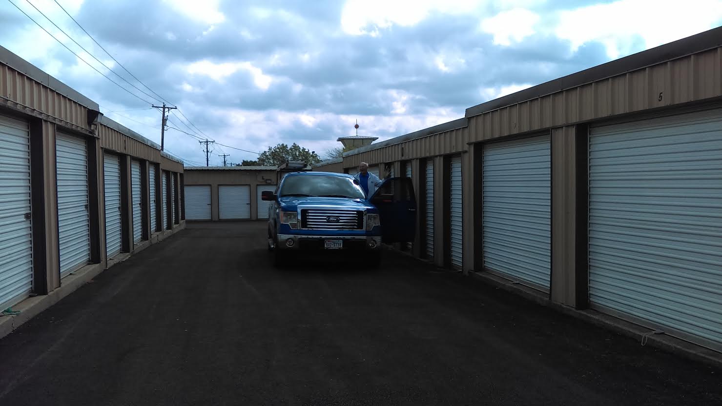 Wide lanes for easy parking and unloading Car parked between storage buildings